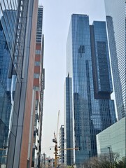Obraz premium Tower crane among high rise buildings in Seoul