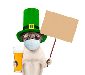 St Patrick's Day during lockdown concept. Funny puppy wearing protective face mask and green...