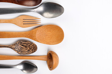 Varity of wooden metal plastic spoon kitchen tableware on white background copy text space