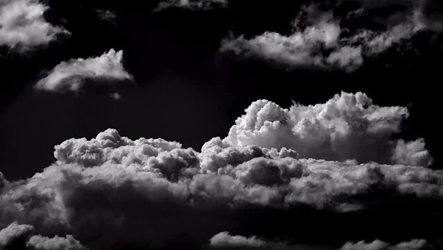 time-lapse of separate white clouds on a black background have real clouds. time-lapse of White cloud isolated on a black background realistic cloud. time-lapse of white fluffy cumulus cloud isolated