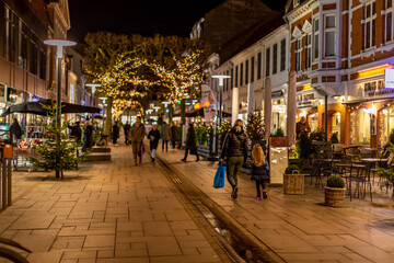Fredericia, DENMARK - 16 December 2021 - Here are people on the pedestrian street, with spruce trees - obrazy, fototapety, plakaty