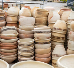 Background of ceramic terracotta pots for sale at greenhouse