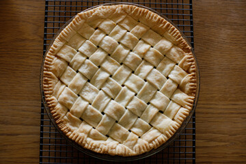 Top view of homemade apple pie on wire baking rack