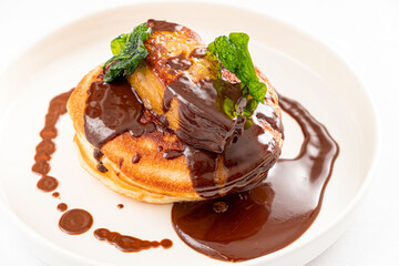 pancakes with chocolate sauce and mint