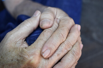 Fototapeta premium Clasped hands of Asian man. Concept of rheumatoid arthritis, osteoarthritis or joint pain.
