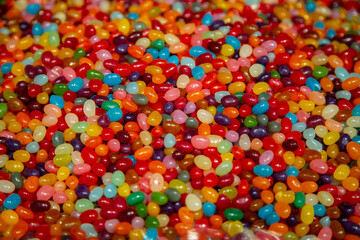Fototapeta na wymiar Multicolored candies. Sweets in a shop window. Dessert and food background