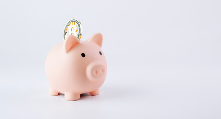 Save currency bitcoin. Pink pig bank with golden bit coin money BTC on white background. Save money investment and business finance.