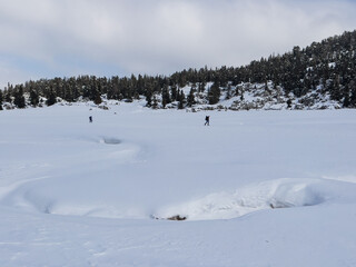 Hiking, traveling, exploring and photography in the mountains after snowfall