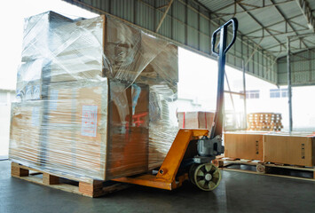 Packaging Boxes Wrapped Plastic Film on Pallets Rack with Hand Pallet Truck. Supply Chain Goods. Storehouse Commerce Shipment. Shipping Warehouse Logistics.	