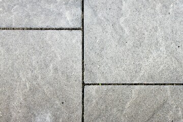 Rectangular gray stone slabs with joints