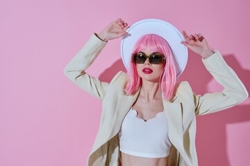 Pretty young female attractive look white blazer pink wig pink background unaltered