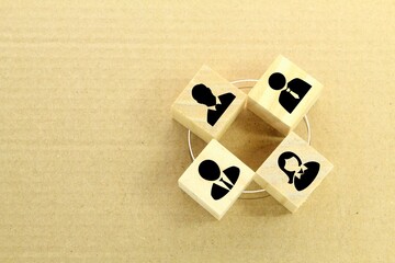 wooden cubes with various teamwork icons. the concept of people connecting with each other.