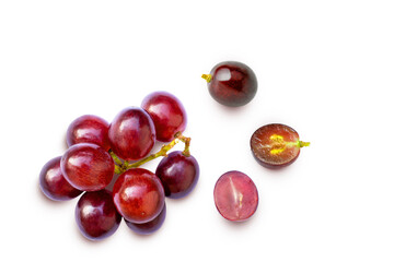 Red grapes fruit with half slice isolated on white background. Top view. Flat lay. Grape pattern texture background.	