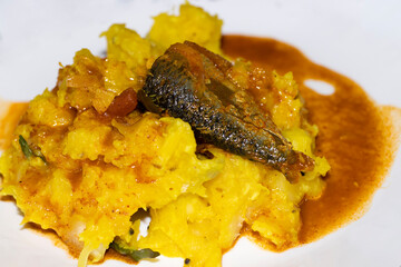 Kerala Style Yellow Tapioca With Fish Curry - obrazy, fototapety, plakaty