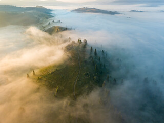 Morning mist in Ukrainian Carpathian mountains. Aerial drone view.