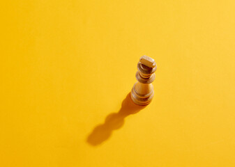King chess piece on yellow background