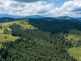 Green Ukrainian Carpathians mountains in summer. Aerial drone view.