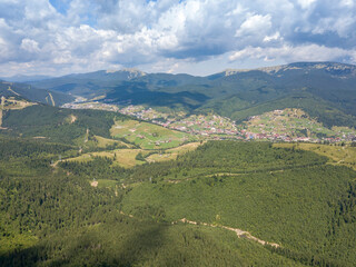 Fototapeta premium Green mountains of Ukrainian Carpathians in summer. Sunny day. Aerial drone view.
