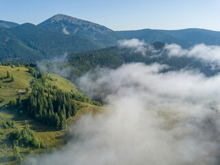 Morning fog in the Ukrainian Carpathians. Aerial drone view.