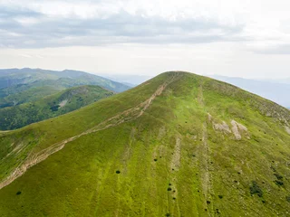 Foto op Canvas High mountains of the Ukrainian Carpathians in cloudy weather. Aerial drone view. © Sergey