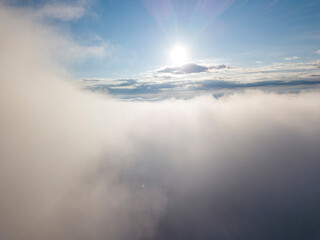 High flight above the clouds. Aerial drone view.