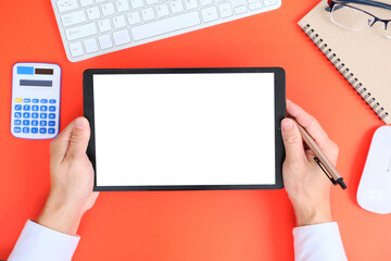 Blank tablet screen while typing on a keyboard, as well as a screen mockup for further customization, can be used for a variety of purposes. area for copying