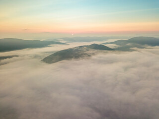 Morning fog in the Ukrainian Carpathians. Aerial drone view.