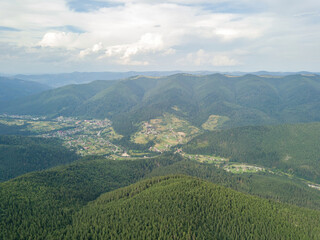 Fototapeta premium Green mountains of Ukrainian Carpathians in summer. Aerial drone view.
