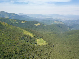 Naklejka premium High mountains of the Ukrainian Carpathians in cloudy weather. Aerial drone view.