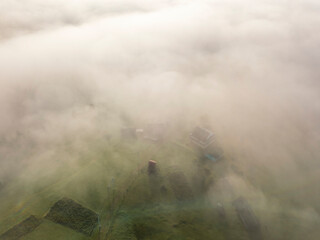 Morning mist in Ukrainian Carpathian mountains. Aerial drone view.