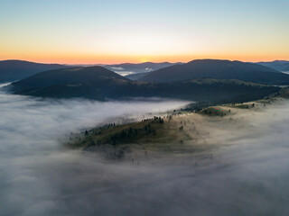 Morning fog in the Ukrainian Carpathians. Aerial drone view.