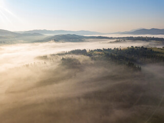 Morning fog in the Ukrainian Carpathians. Aerial drone view.