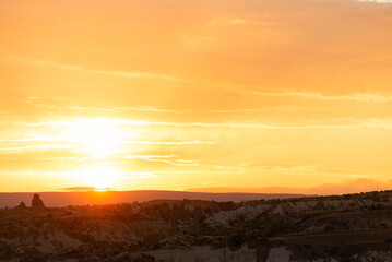 Obraz premium Amazing orange sunrise in Cappadocia, Turkey with soft selective focus. Beauty of nature concept