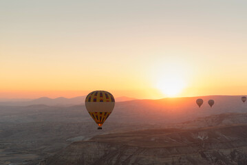 Obraz premium Hot air balloons in the sky during sunrise. Travel, dreams come true concept
