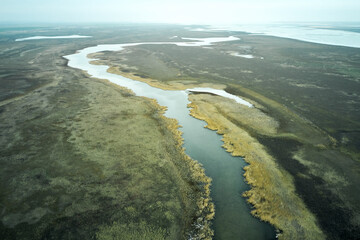 Fototapeta premium steppe plain landscape lake in the middle of fields