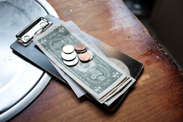 Tip money on restaurant's table.Change money on table