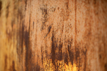 Rusty metal. Texture of rust on wall. Brown shades. Spoiled steel.