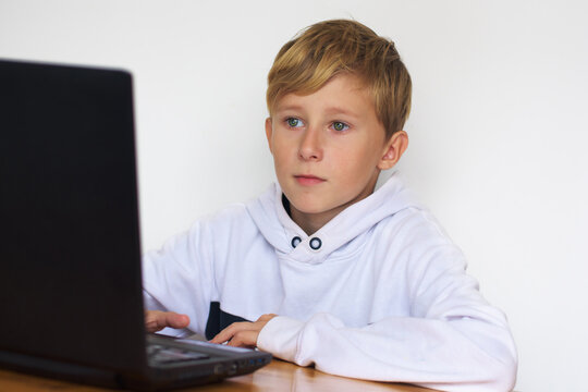 portrait of a boy at a computer