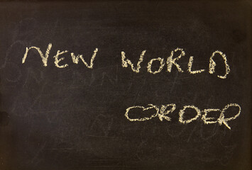 Fototapeta premium The term NEW WORLD ORDER visually displayed on a blackboard with copy space