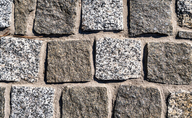 Texture of stone wall or paved road. Part of a stone wall for background or texture. Grunge.