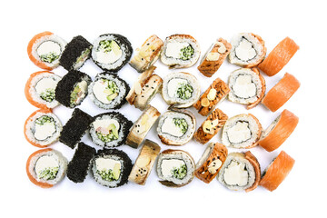 Huge sushi set with nori, red fish and shrimps on a white background