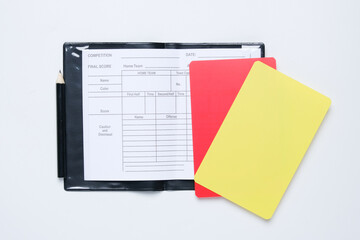 A picture of referee match equipment with red and yellow card insight. Follow the rules concept.