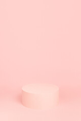 Fashion pastel pink stage with one round podium mockup on soft light background, copy space, vertical. Trendy template showcase for presentation cosmetic product, goods, advertising, design.