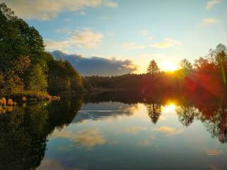 Fototapeta na wymiar Dawn of the sun on a blue lake in Kazan.
