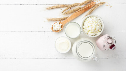 Organic dairy products on a white wooden background top view