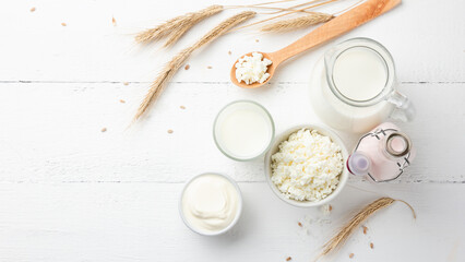 Organic dairy products on a white wooden background top view