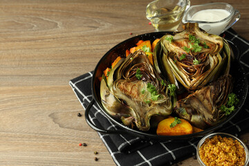 Concept of tasty food with grilled artichoke, space for text