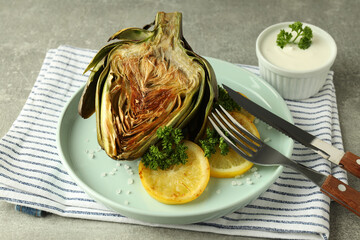Concept of tasty food with grilled artichoke, close up