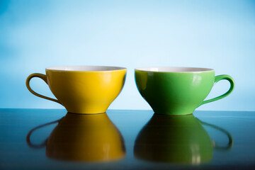 yellow and green tea cups 
