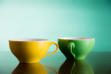 yellow and green tea cups 